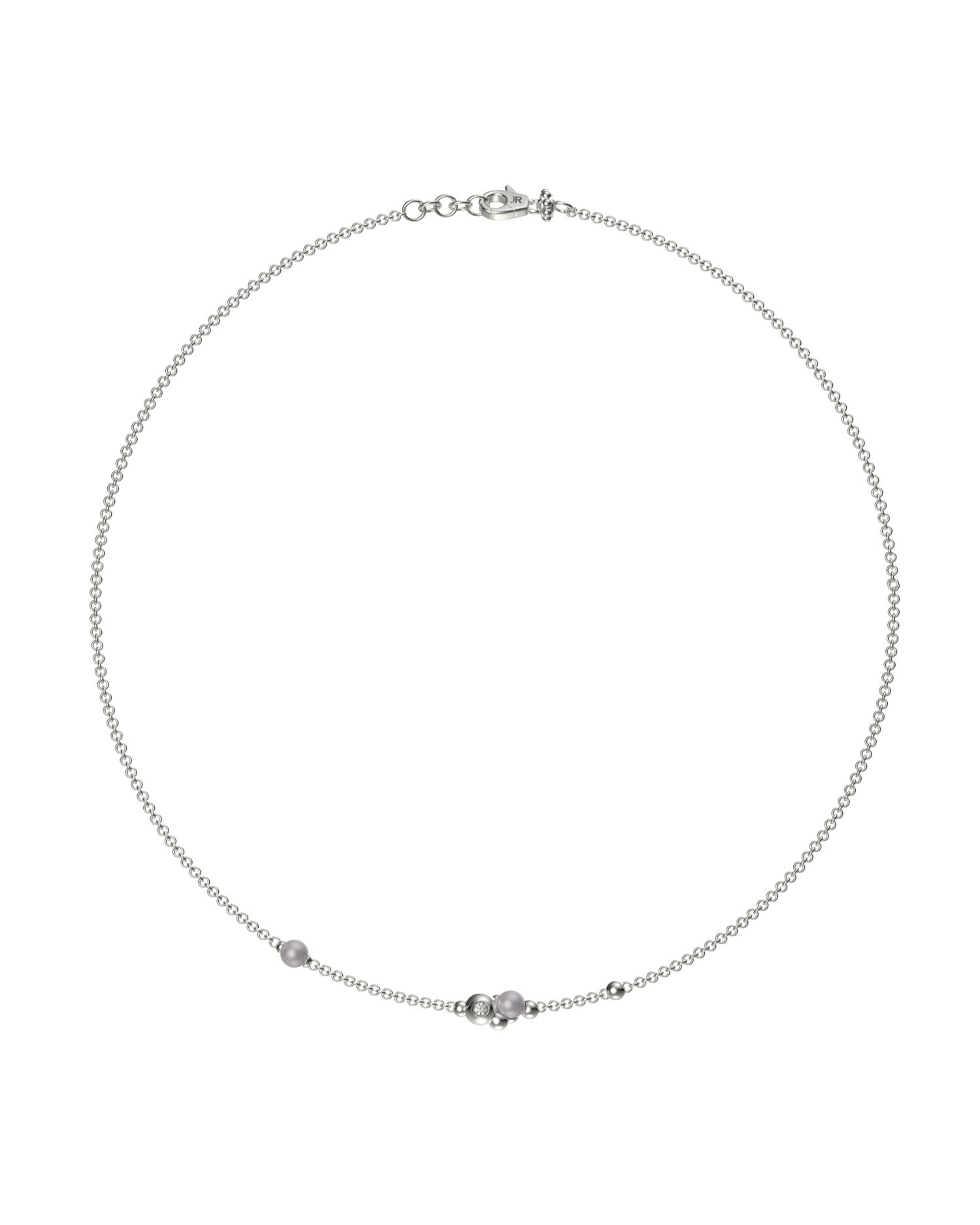 Collana John Richmond con catena sottile, elementi sferici e un punto luce centrale.