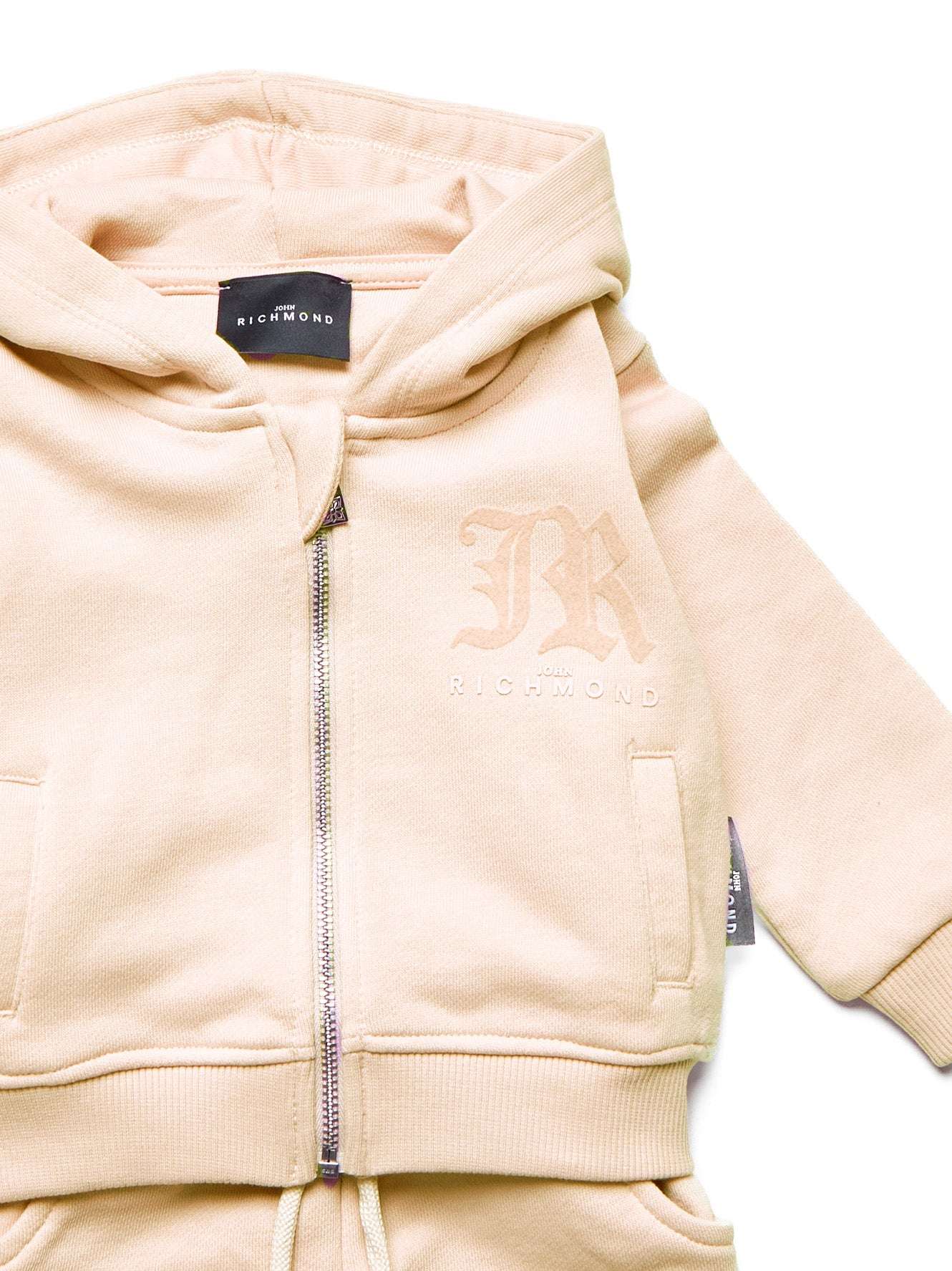 Coordinated sweatshirt and trousers set. Suit