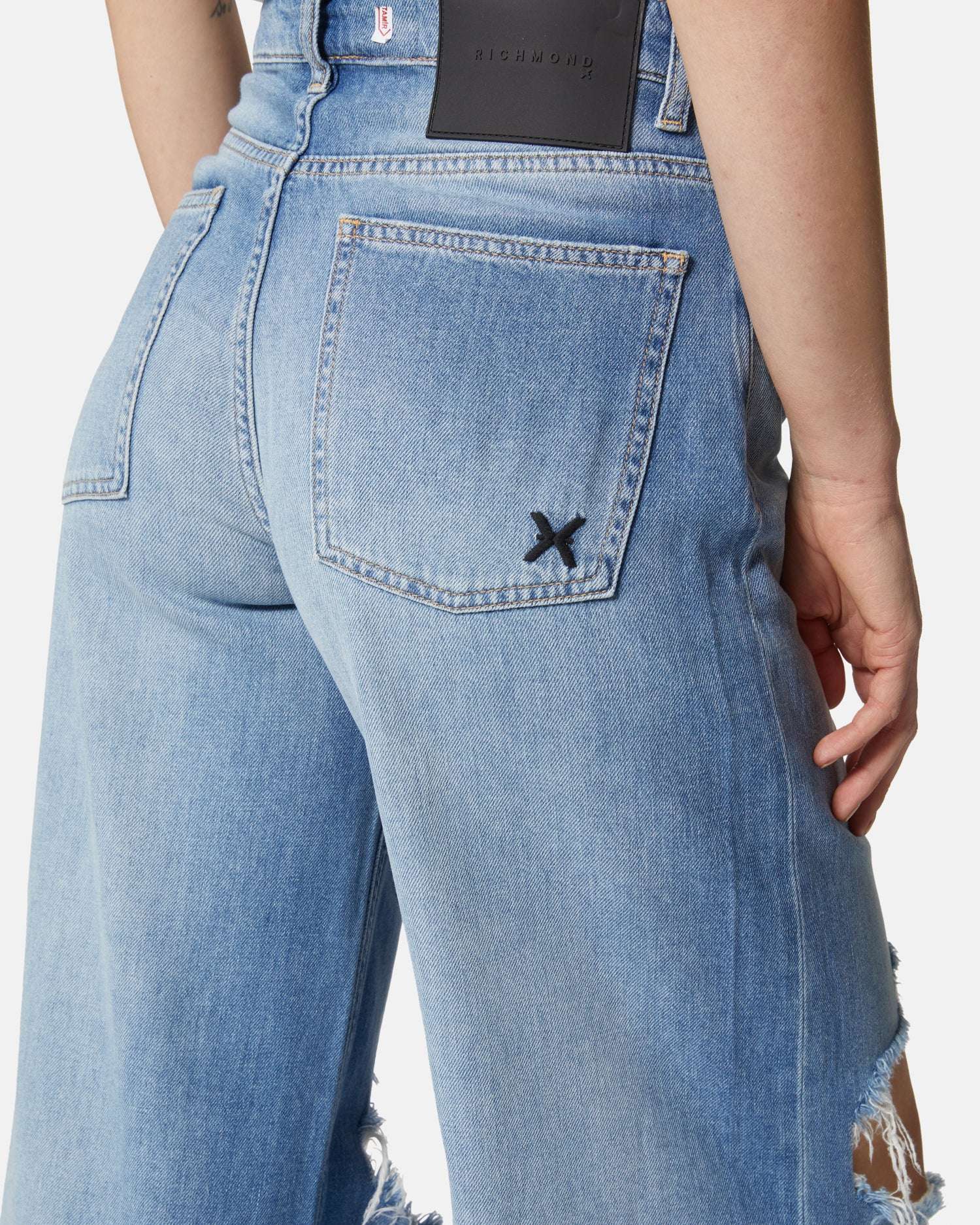 Jeans a gamba larga blu chiaro con strappi sulle ginocchia Jeans