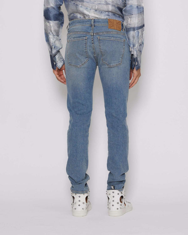 Jeans slim con lavaggio effetto used