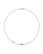 Collana John Richmond con catena sottile, elementi sferici e un punto luce centrale.