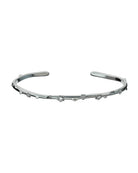 Bracciale rigido con finitura lucida e decorazioni a forma di rosa con elementi brillanti al centro.