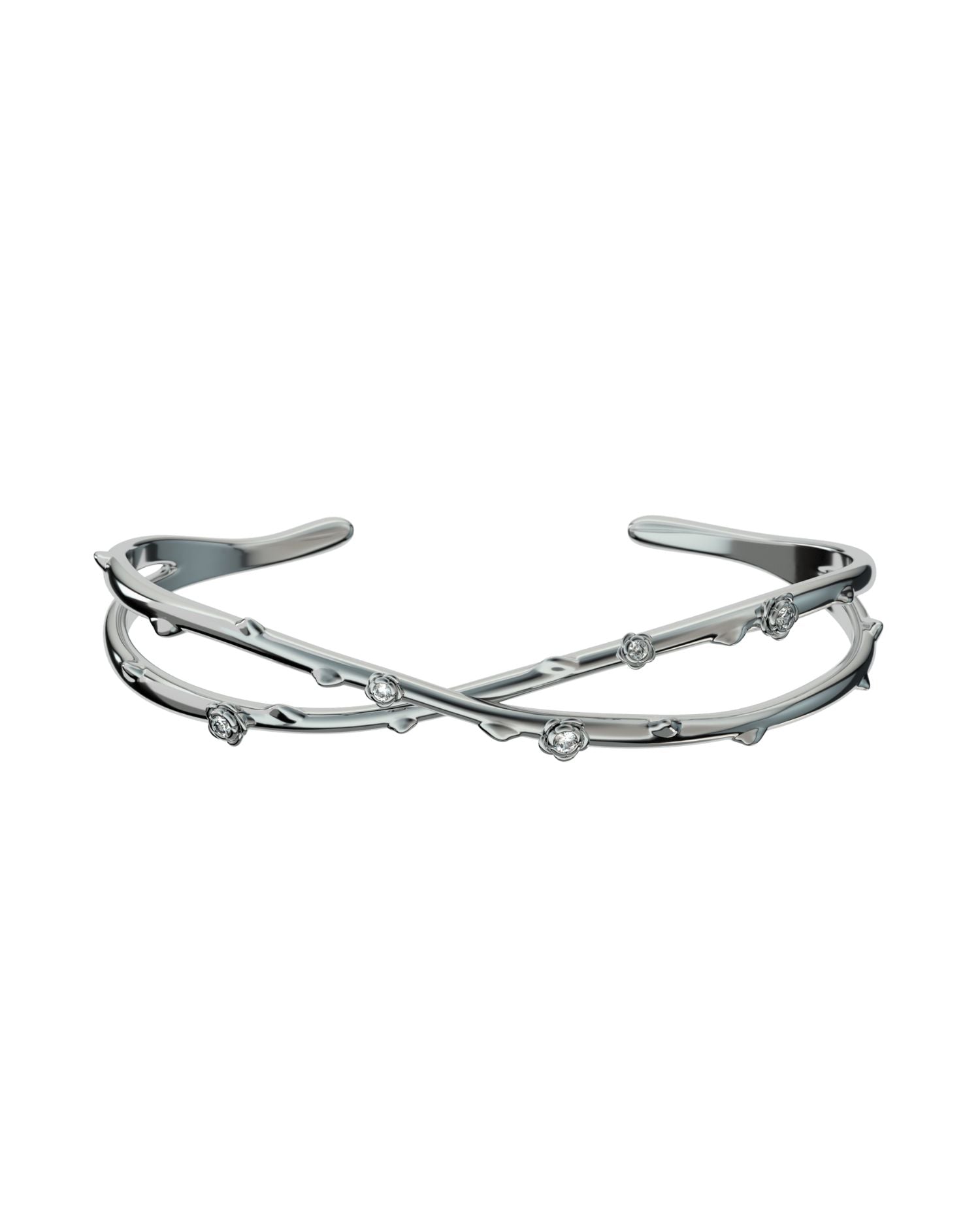 Bracciale rigido aperto con design a rami intrecciati e dettagli luminosi con motivi floreali.