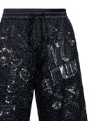 Bermuda uomo nero con dettagli lucidi e scritta frontale Bermuda