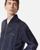 Bomber blu scuro con dettagli minimal Capospalla