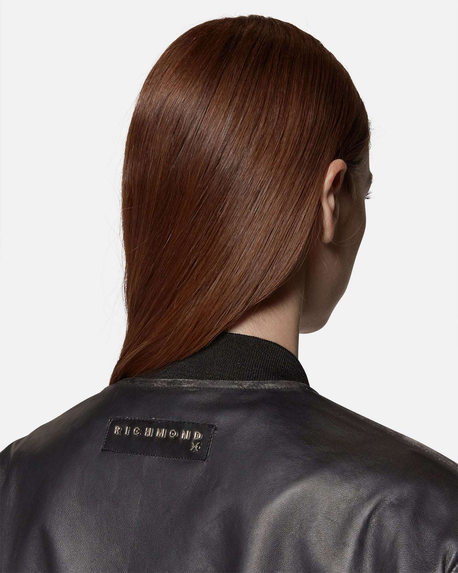 Bomber in ecopelle nera con dettagli a costine Capospalla