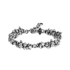 Bracciale in metallo con dettagli borchiati e cristalli - argento