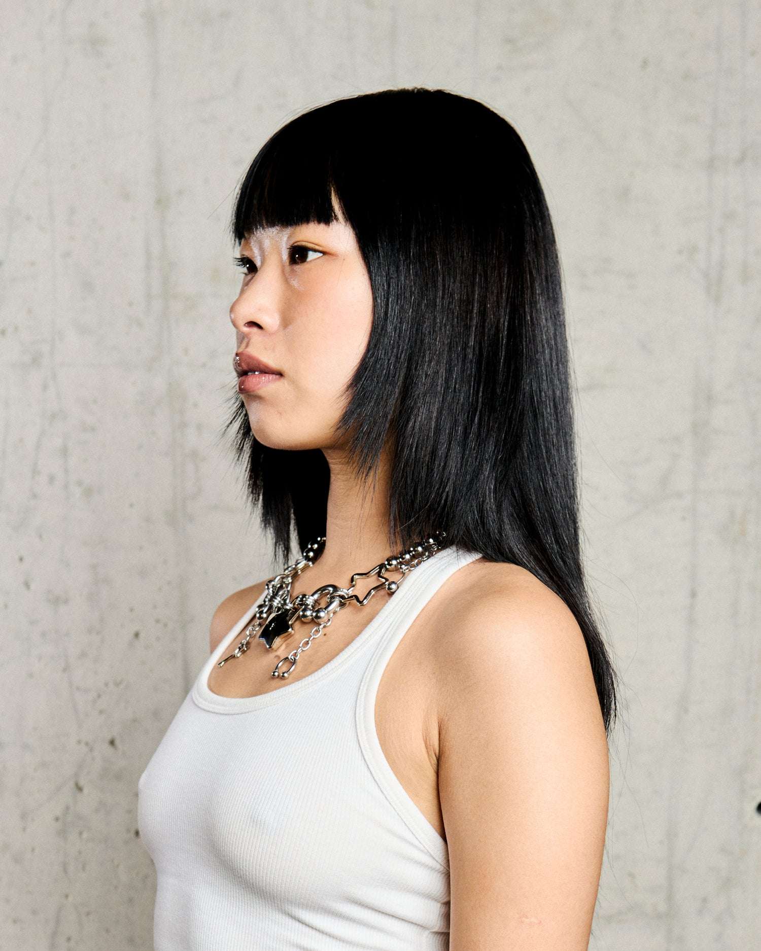 Collana con Stelle e Dettagli Intrecciati