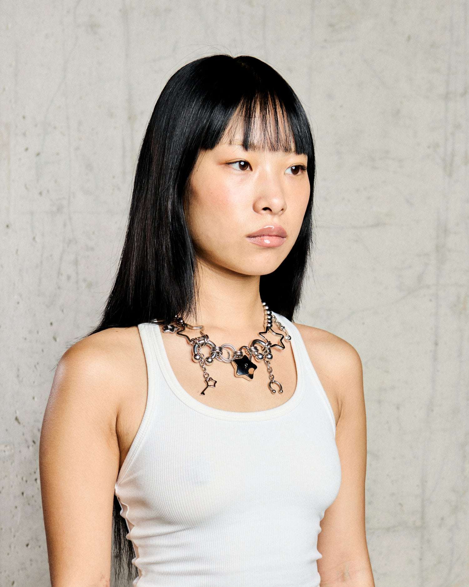 Collana con Stelle e Dettagli Intrecciati