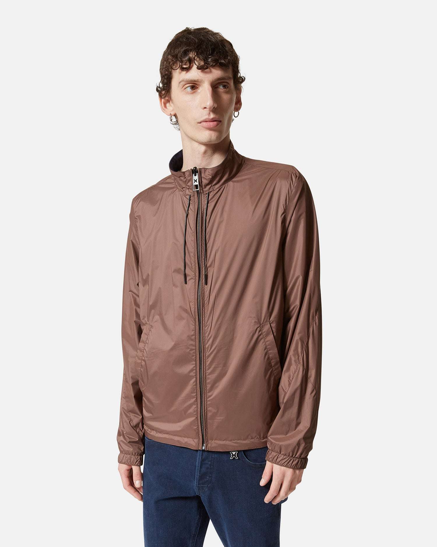 Giacca leggera antivento con cappuccio nascosto Giubbino