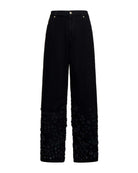 Jeans baggy con scritta RICH e dettagli decorativi Jeans