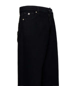 Jeans baggy con scritta RICH e dettagli decorativi Jeans