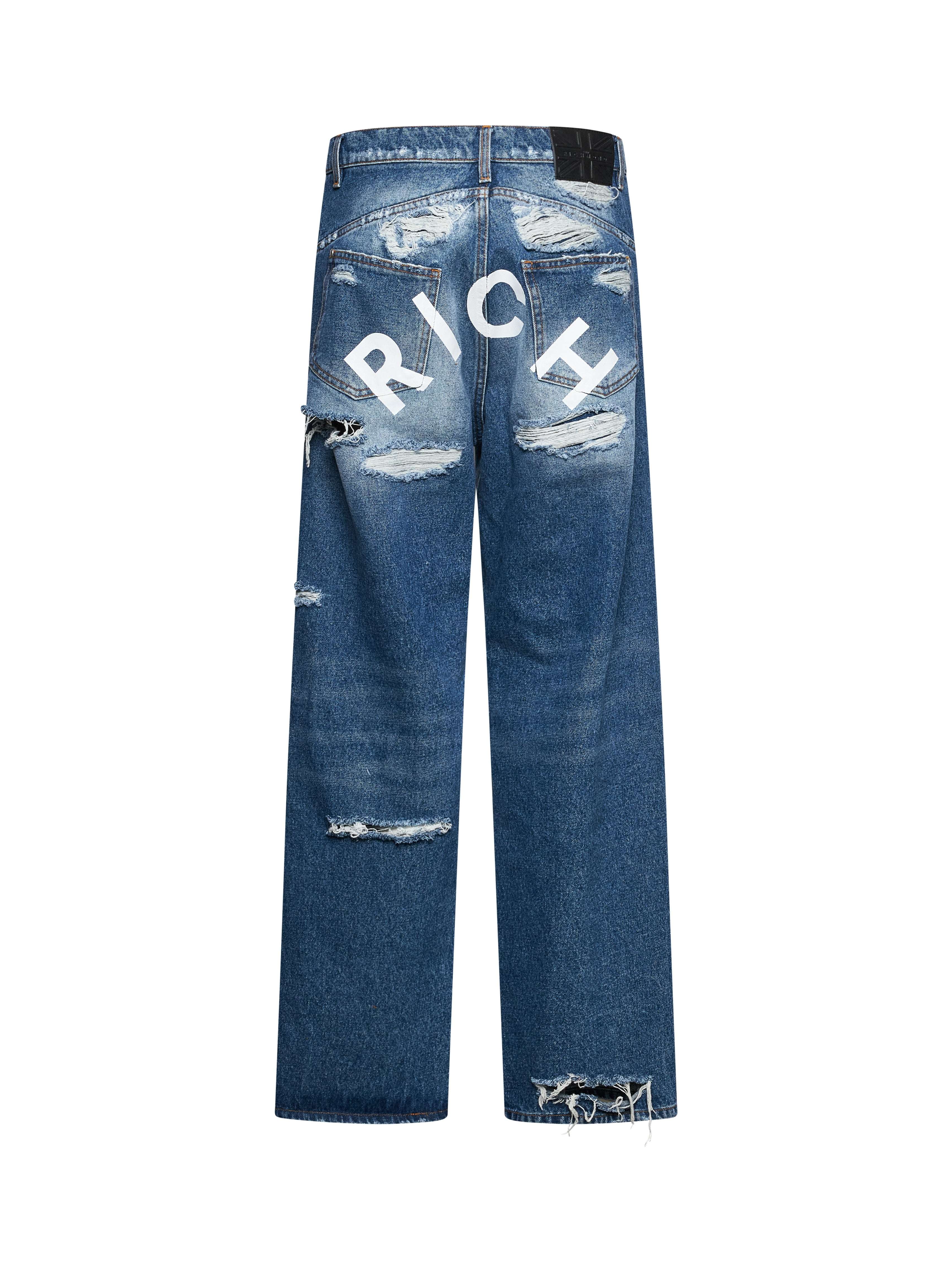 Jeans iconici con lettering &amp;ldquo;RICH&amp;rdquo; sul retro e dettagli destroyed Jeans