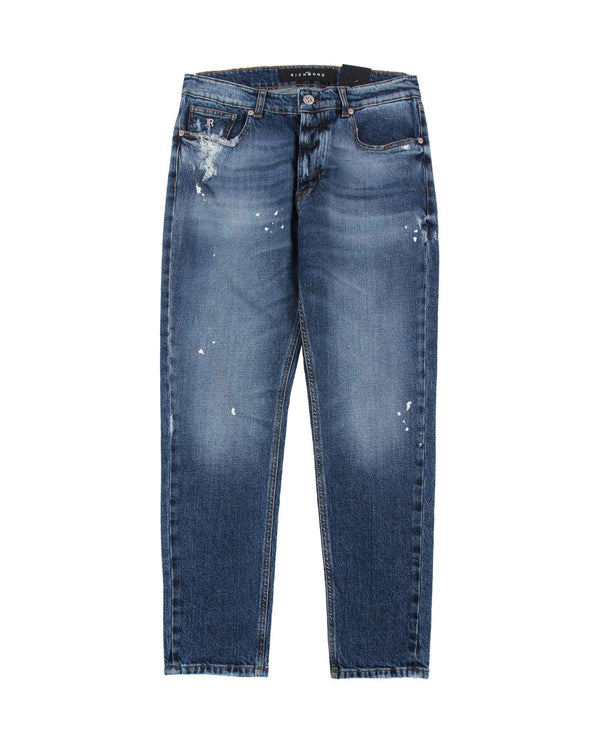 Jeans slim con strappi sul davanti e stampa sul retro