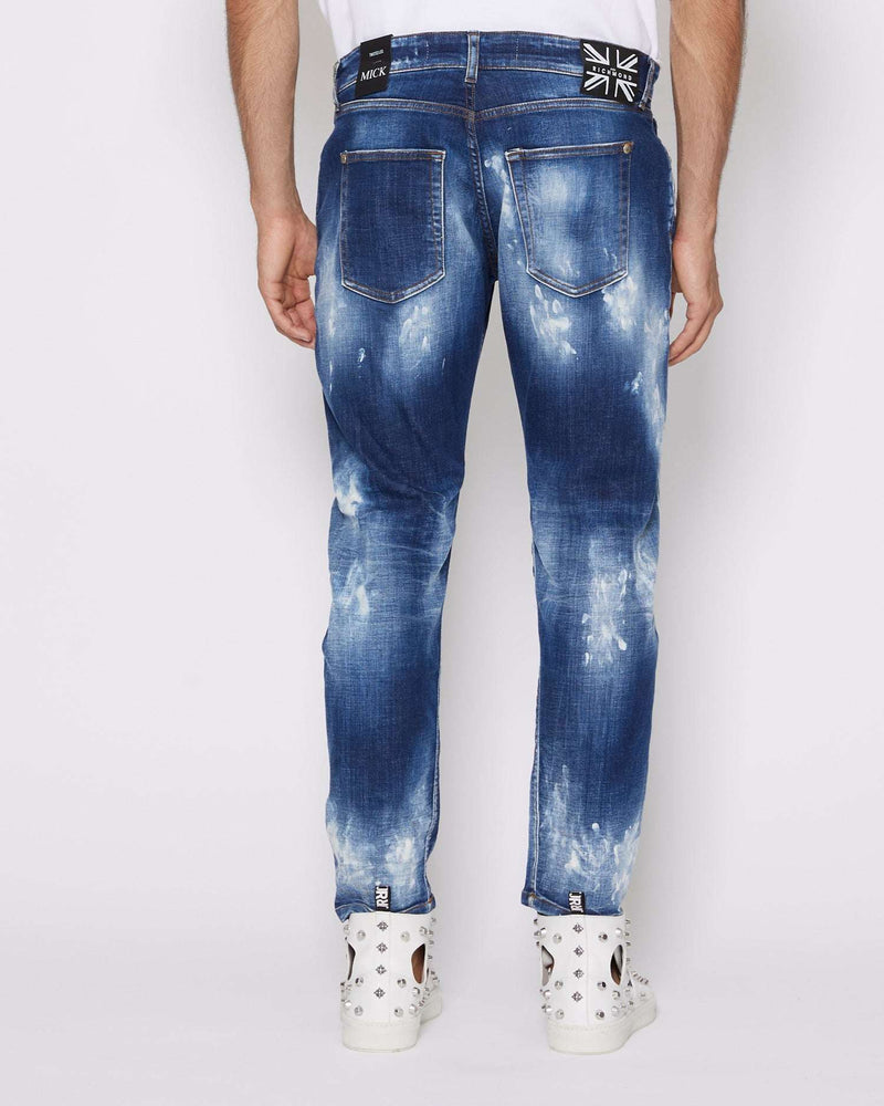 Jeans slim con strappi sul davanti bleaching effect