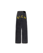Jeans super baggy in denim nero con lettering "RICH" Jeans