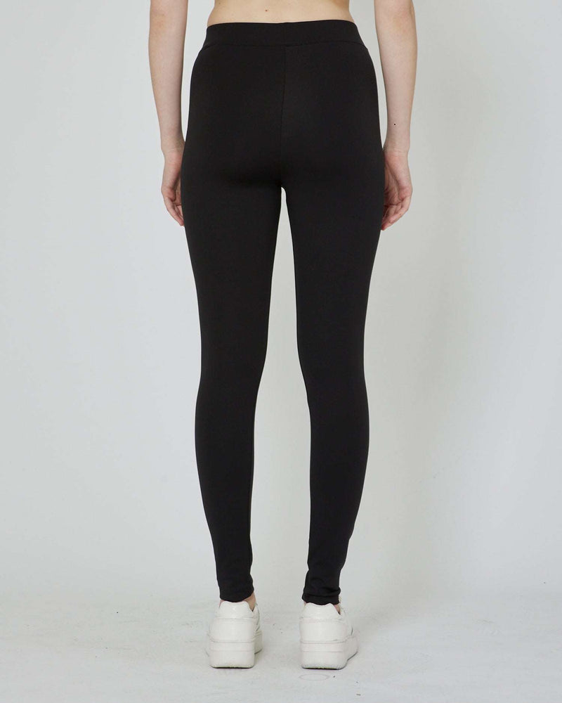 Leggings with metal label on the front