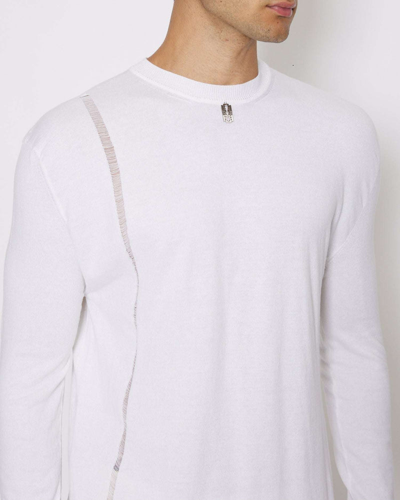 Sweater with metal label on the front