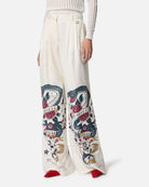 Pantaloni bianchi con stampa grafica e vita alta Pantaloni