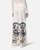 Pantaloni bianchi con stampa grafica e vita alta Pantaloni