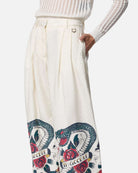 Pantaloni bianchi con stampa grafica e vita alta Pantaloni