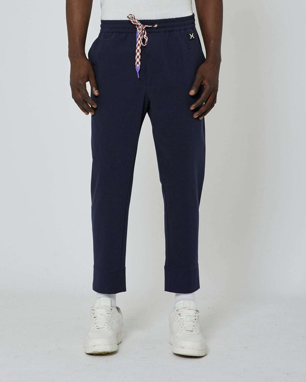 Jogging pants with metallic logo on the front