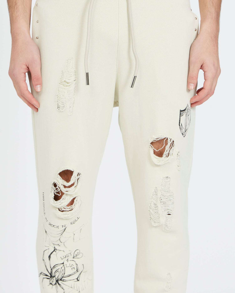 Jogging pants with print and rips