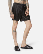 Shorts in tessuto lucido nero con vita elasticizzata Shorts