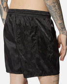 Shorts in tessuto lucido nero con vita elasticizzata Shorts